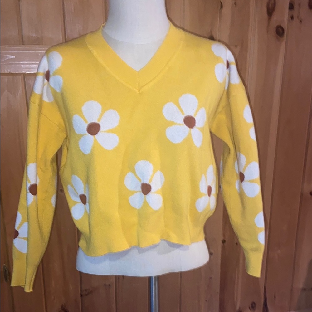 Vibrant Yellow V-Neck Sweater with White Floral Design